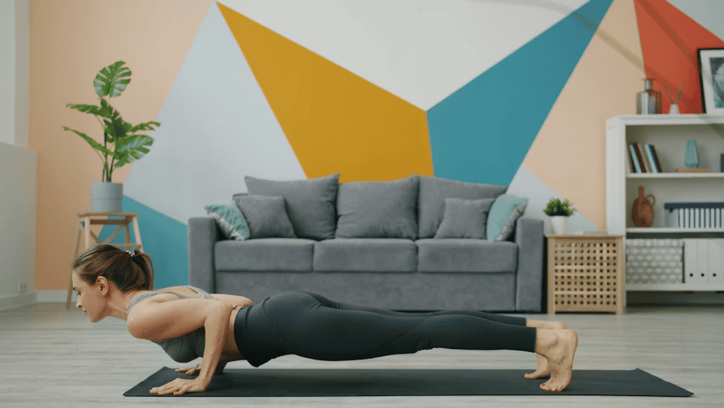 woman doing a plank on the floor in living room