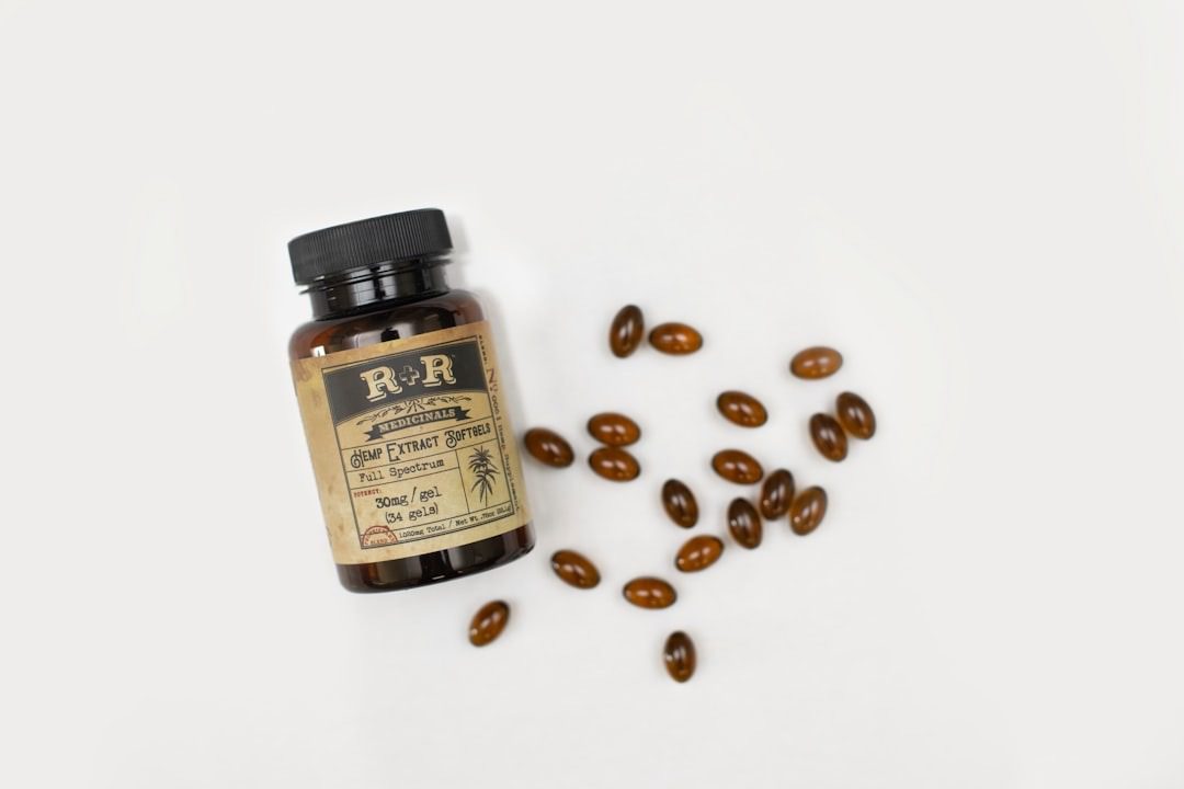 Supplement bottles with branded label design on a desk