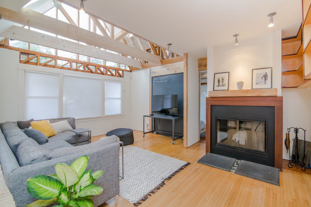 large open plan living room with white walls and modern decor