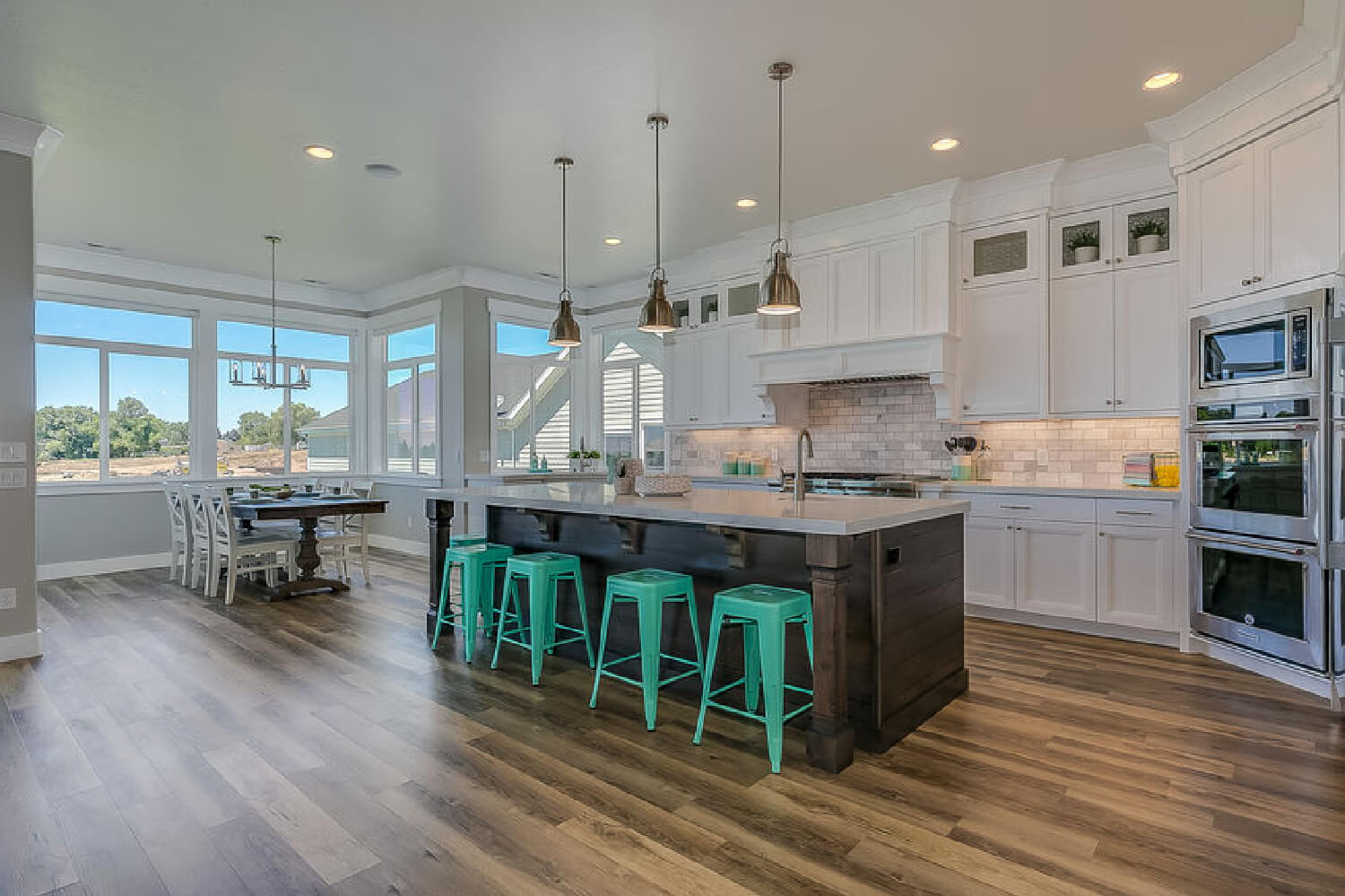 modern kitchen with island and bright blue stools