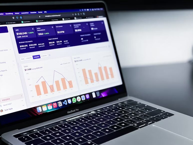 open laptop with bar charts on the screen
