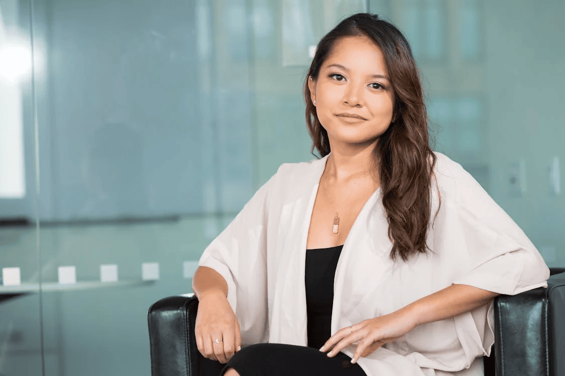 woman in business attire smiling at camera
