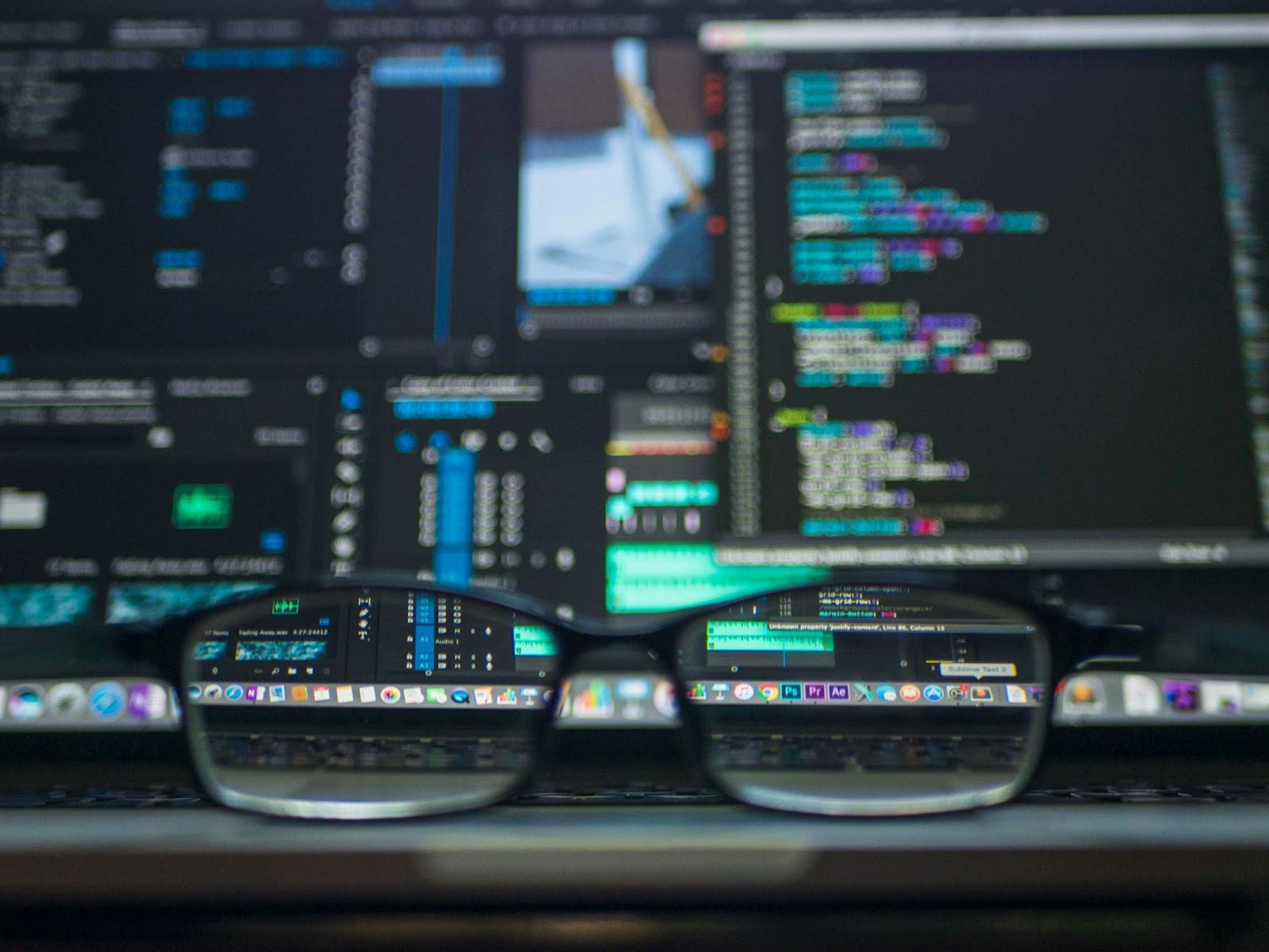 software on computer with black glasses in front