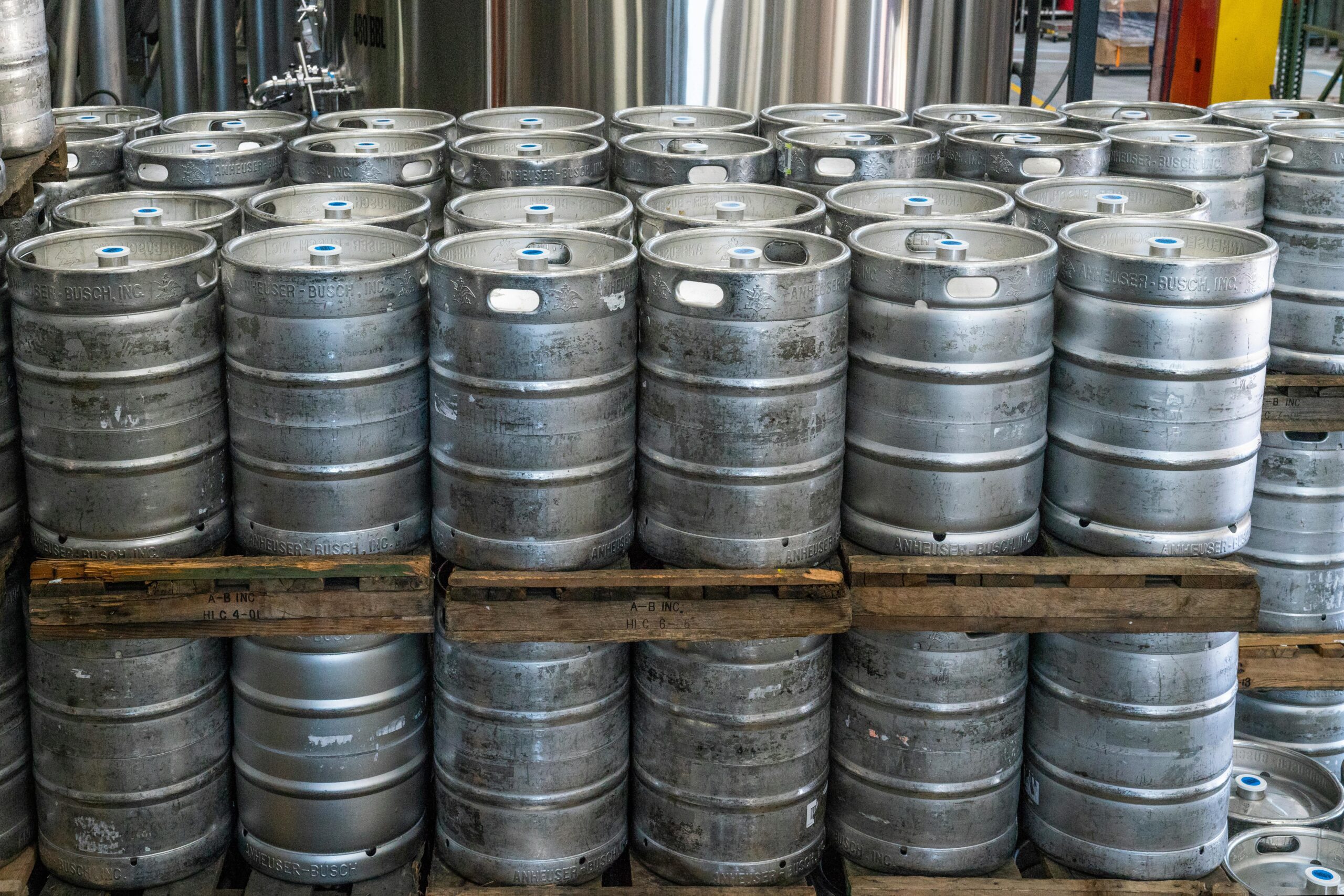 stacks of metal beer kegs