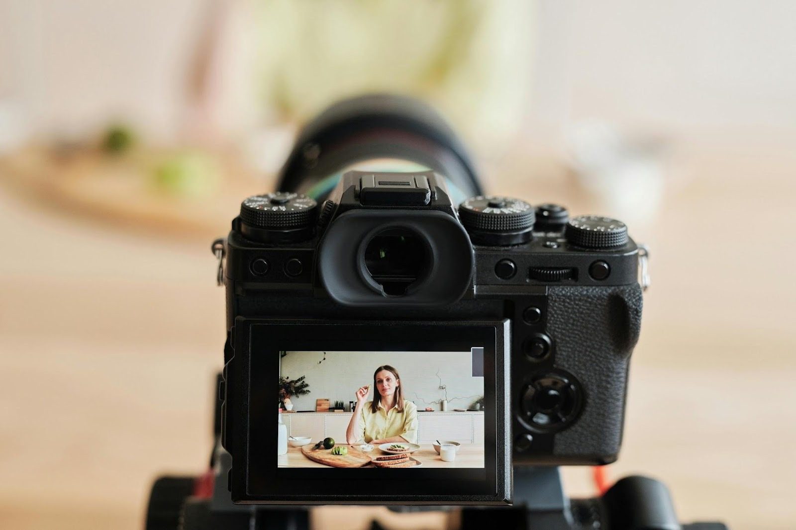 looking through a camera lens at person