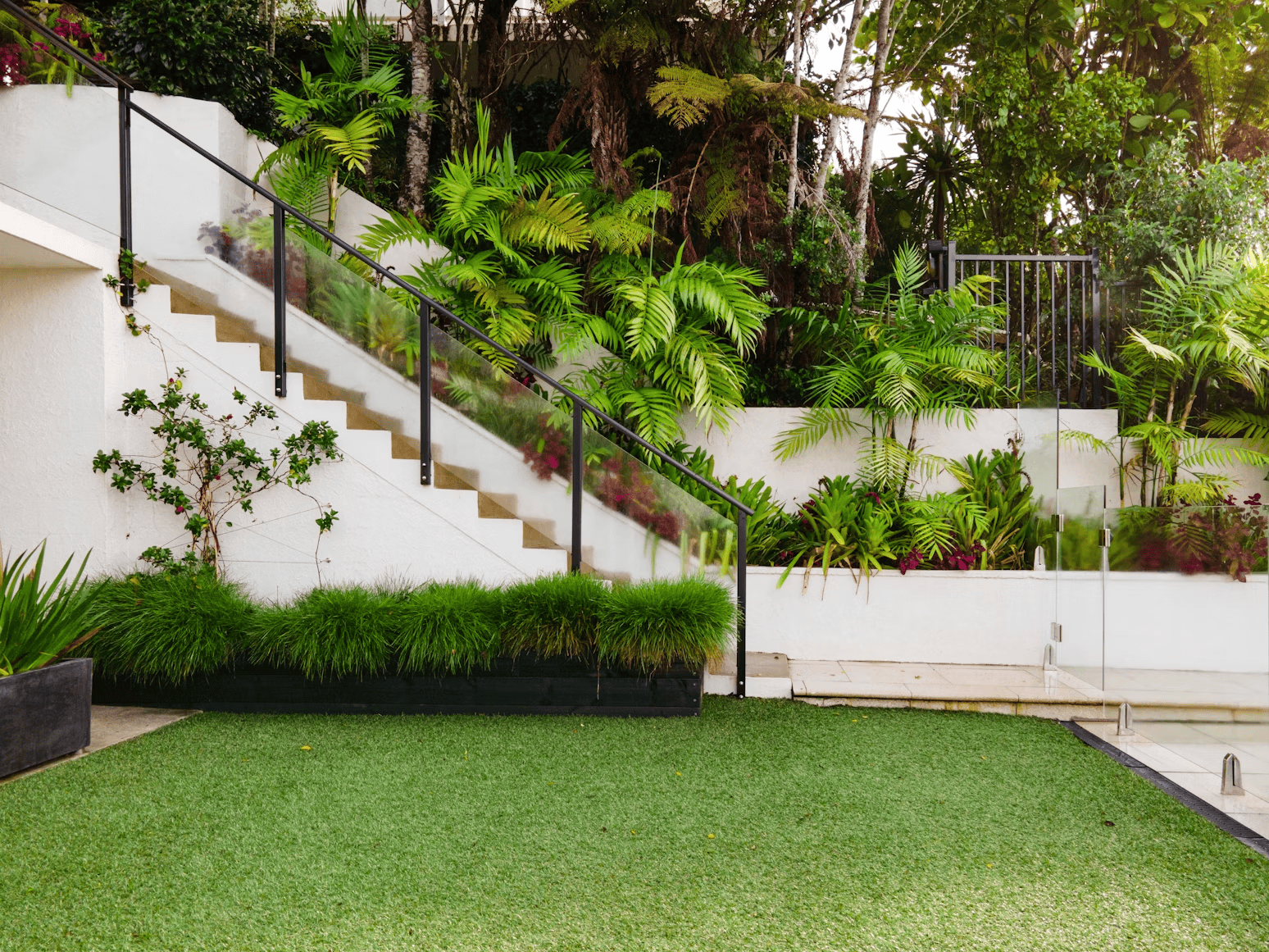 green garden with stairs going up and plants