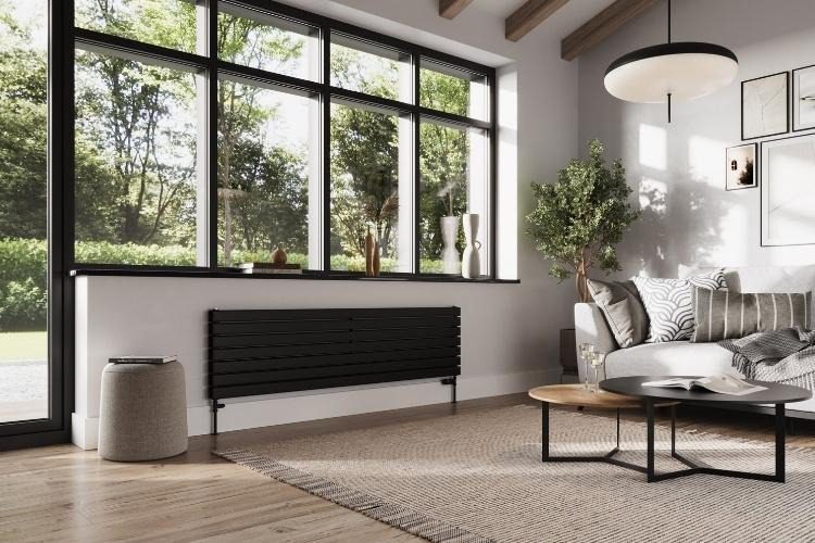 living room with black radiator and large window