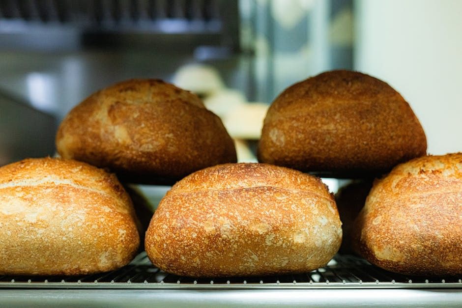 loaves of bread on metal rack
