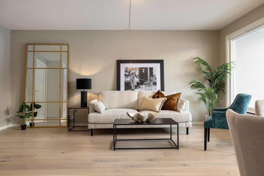 living room with a sofa and tables, lamps