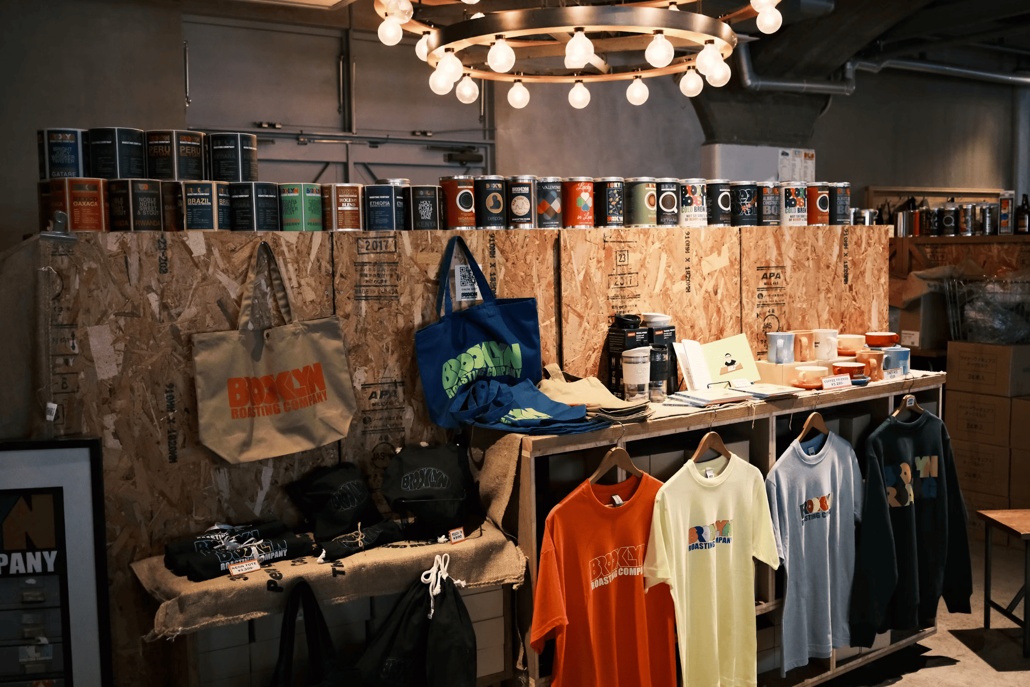 t-shirts, bags and other items on display in shop