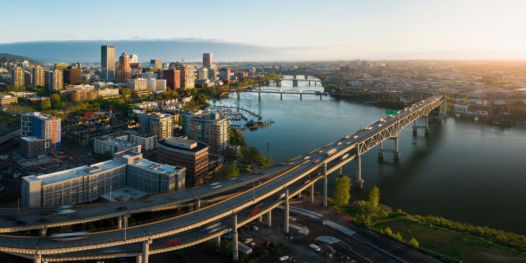 Panoramic aerial image of the Marquam bridge in downtown Portland at sunrise