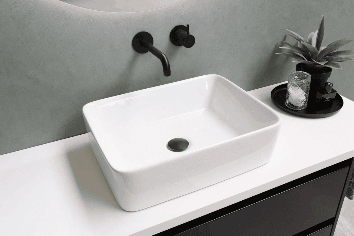 white bathroom sink wotj black taps and plug